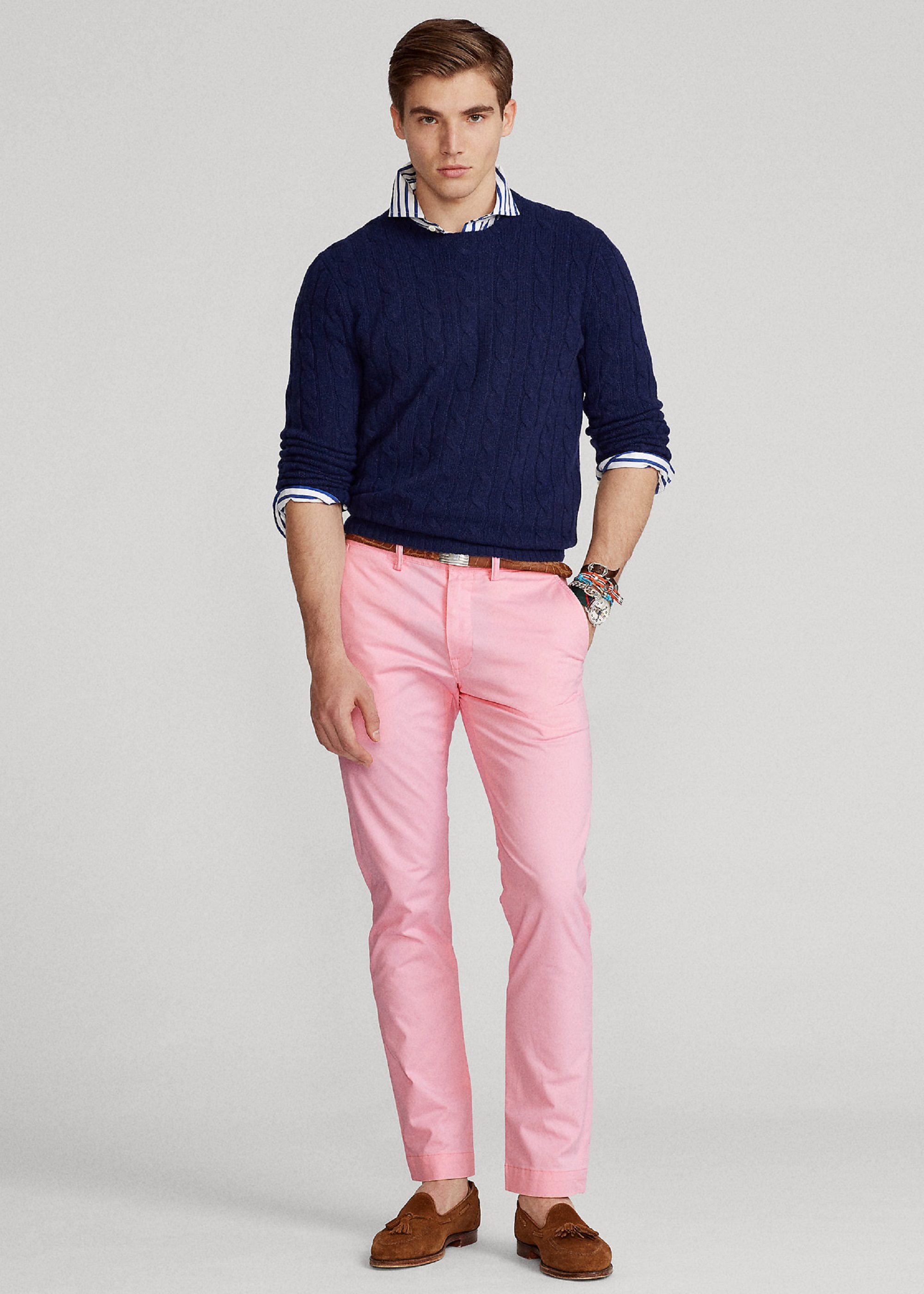 Model in pink Ralph Lauren chinos and dark blue sweater