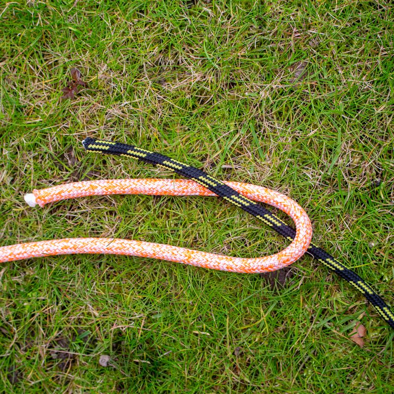 Two ropes start being tied into a sheet bend.