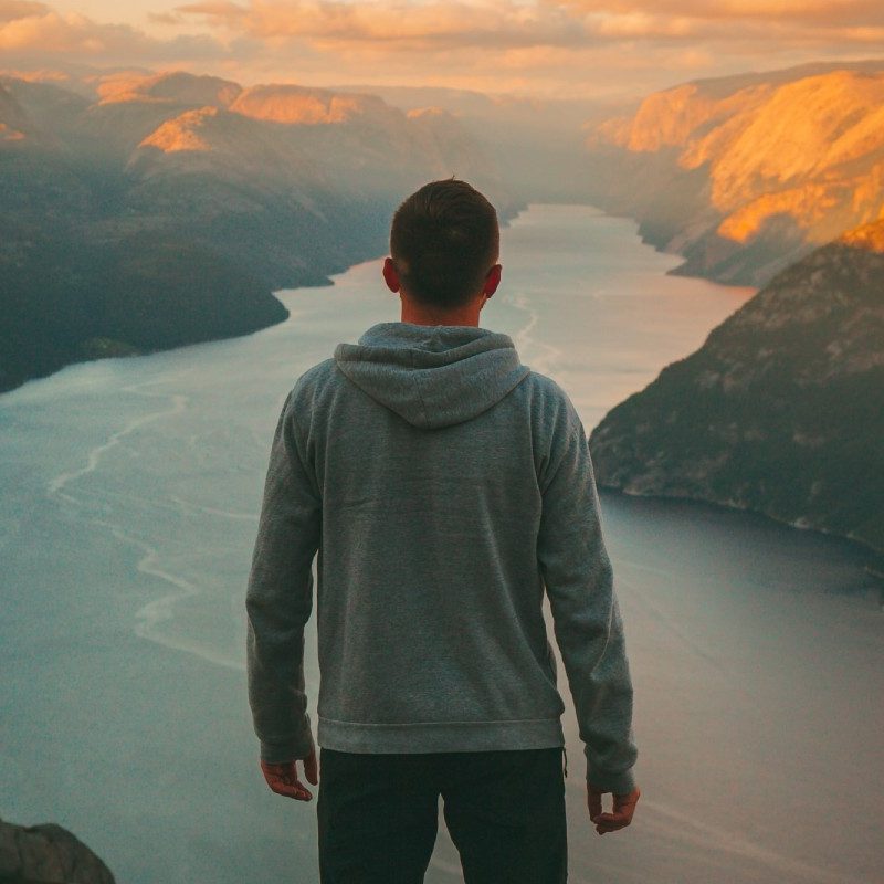 A man looking over a valley.
