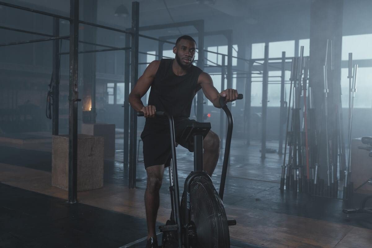 Man on stationary bike in the gym