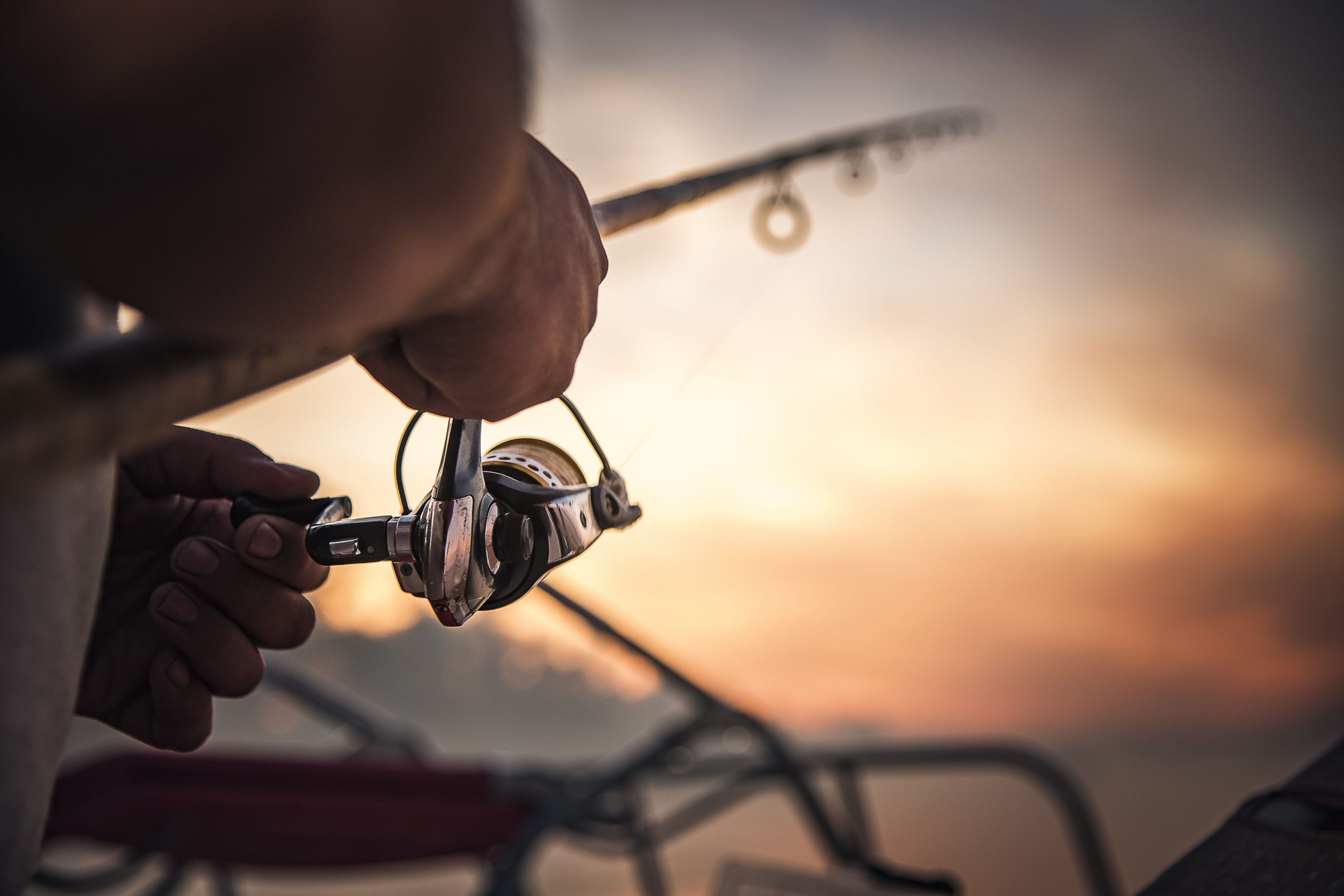 closeup of a man holding a fishing rod