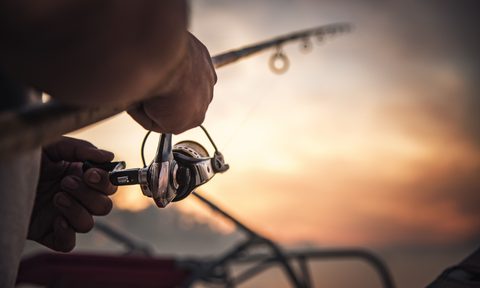 Closeup of a man holding a fishing rod