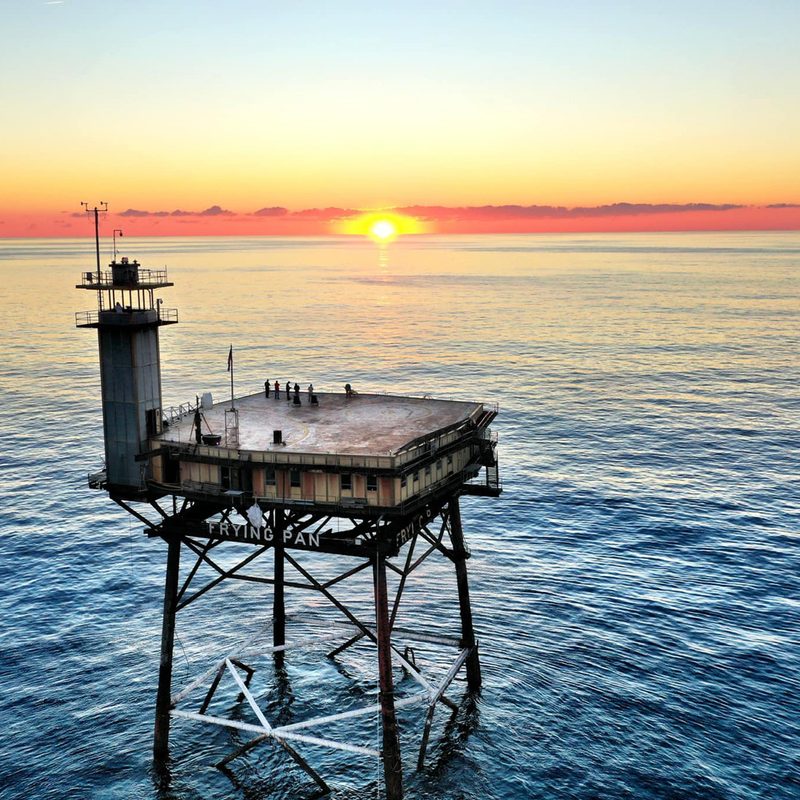 An aerial view of North Carolina's Frying Pan Tower at sunrise.