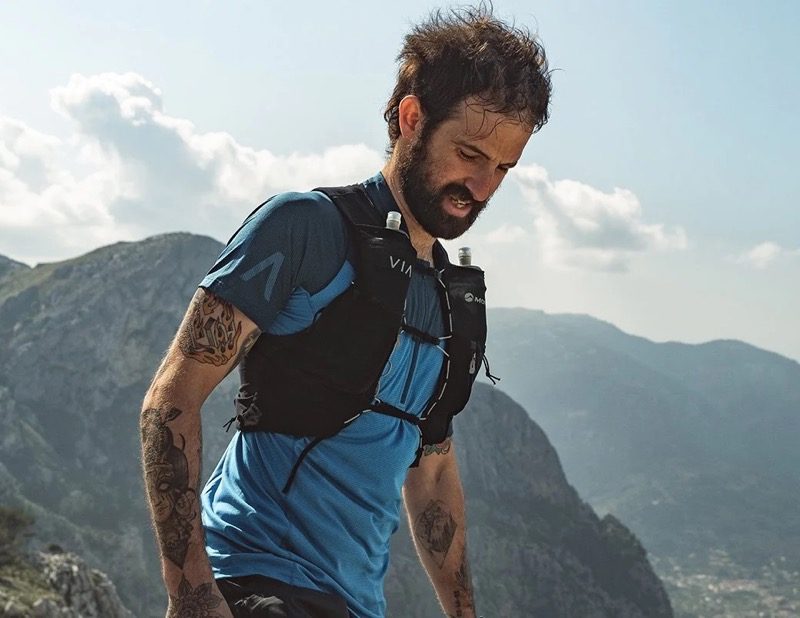 A man wearing Montane trail running gear in the mountains.
