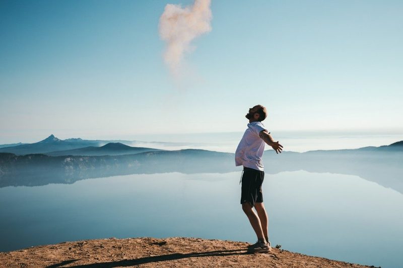 A happy man under a blue sky