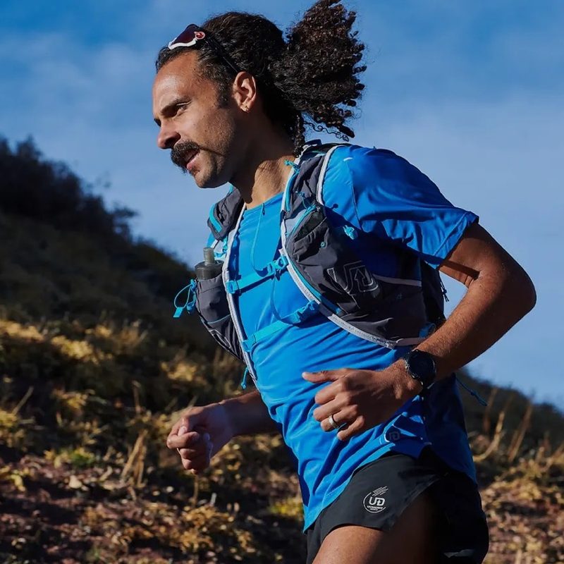An Ultimate Direction athlete out on a trail run