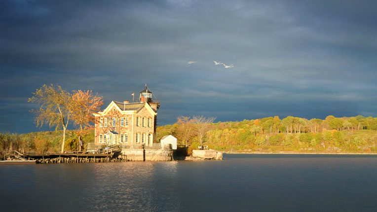 Saugerties Lighthouse Hotel as seen from the water in Saugerties, New York