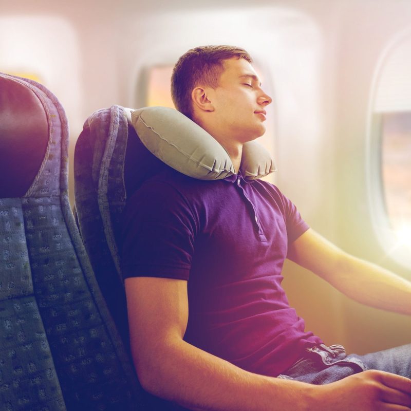Man sleeping on a plane