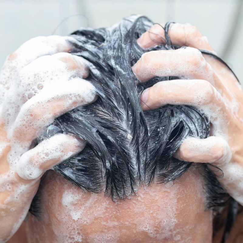 Man washing his hair