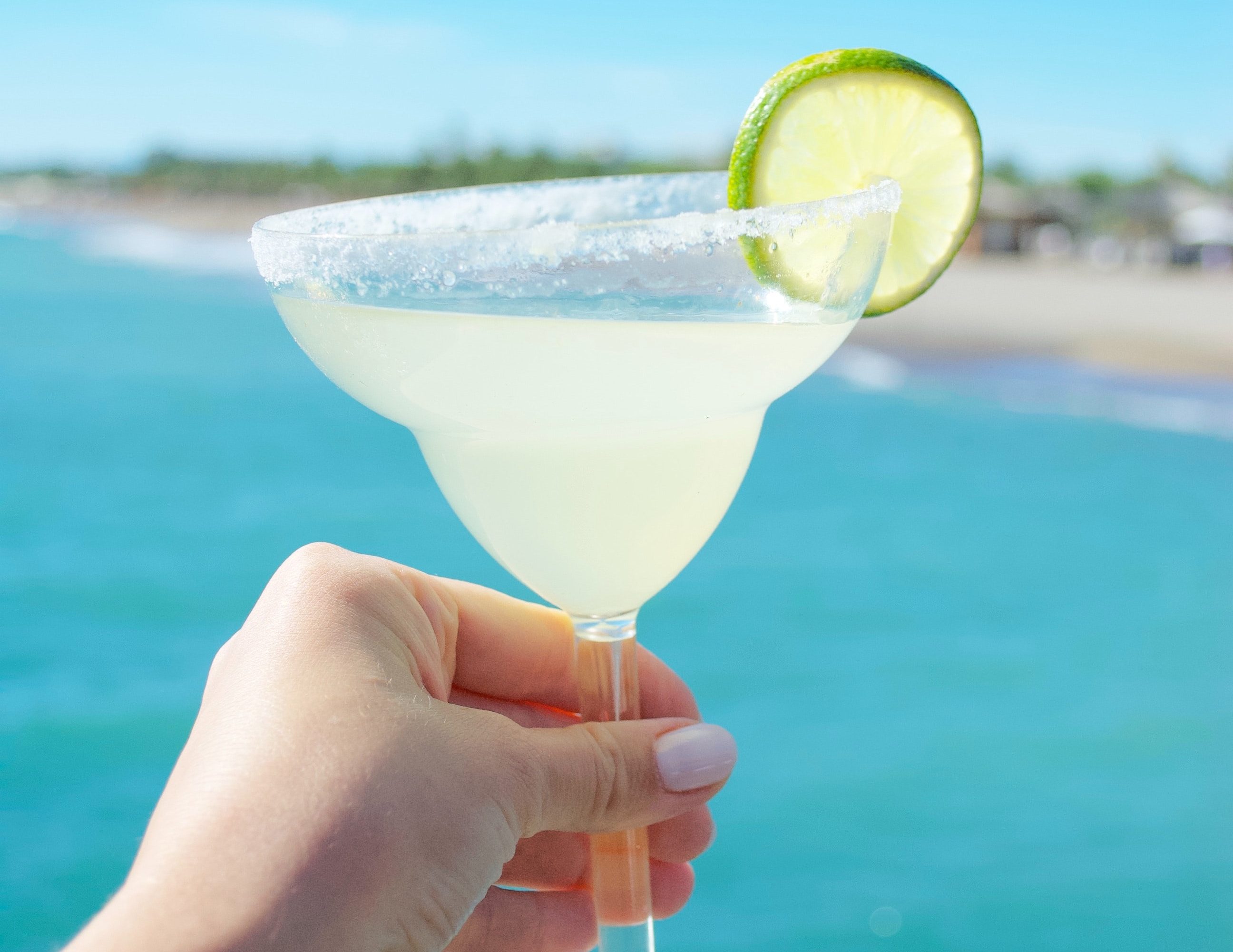 Margarita with water in the background