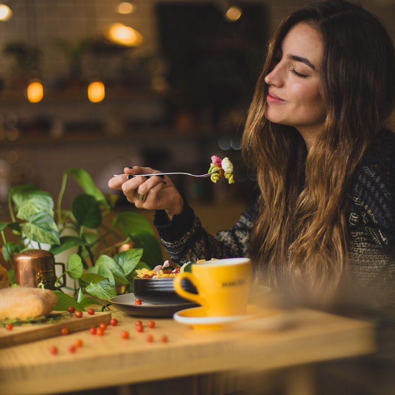 Woman eating and enjoying