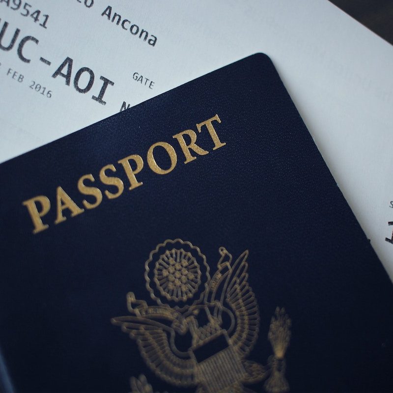 A passport with a boarding pass