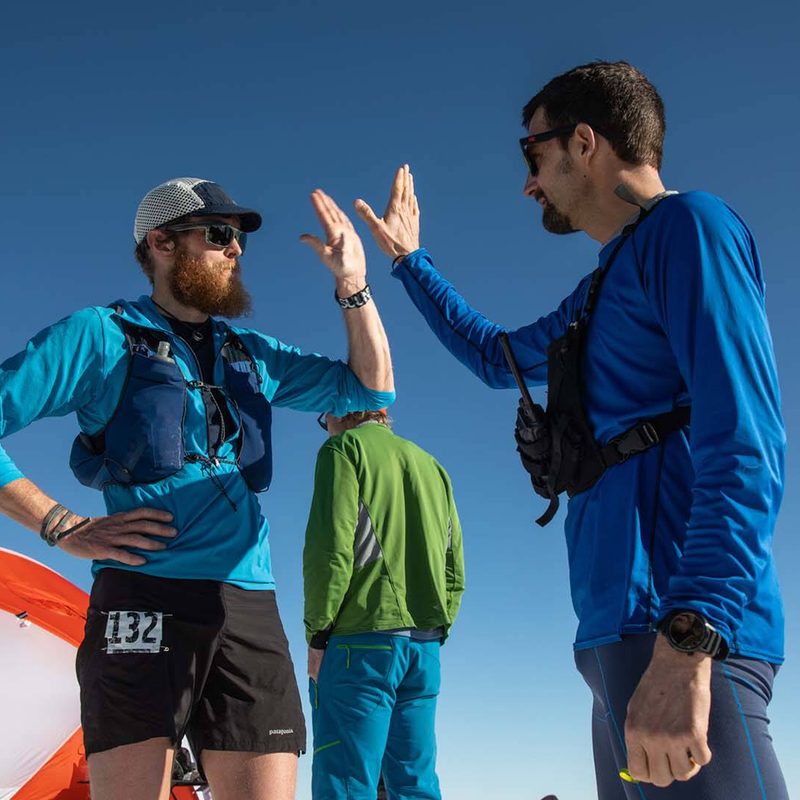 Two Patagonia trail running athletes in camp at the end of their run.