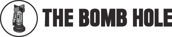 The Bomb Hole logo, the words are written in full next to the image of a bomb landing nose down on the ground.