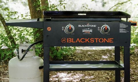 The Blackstone Adventure Ready 2-Burner 28-inch Griddle Cooking Station outside.,