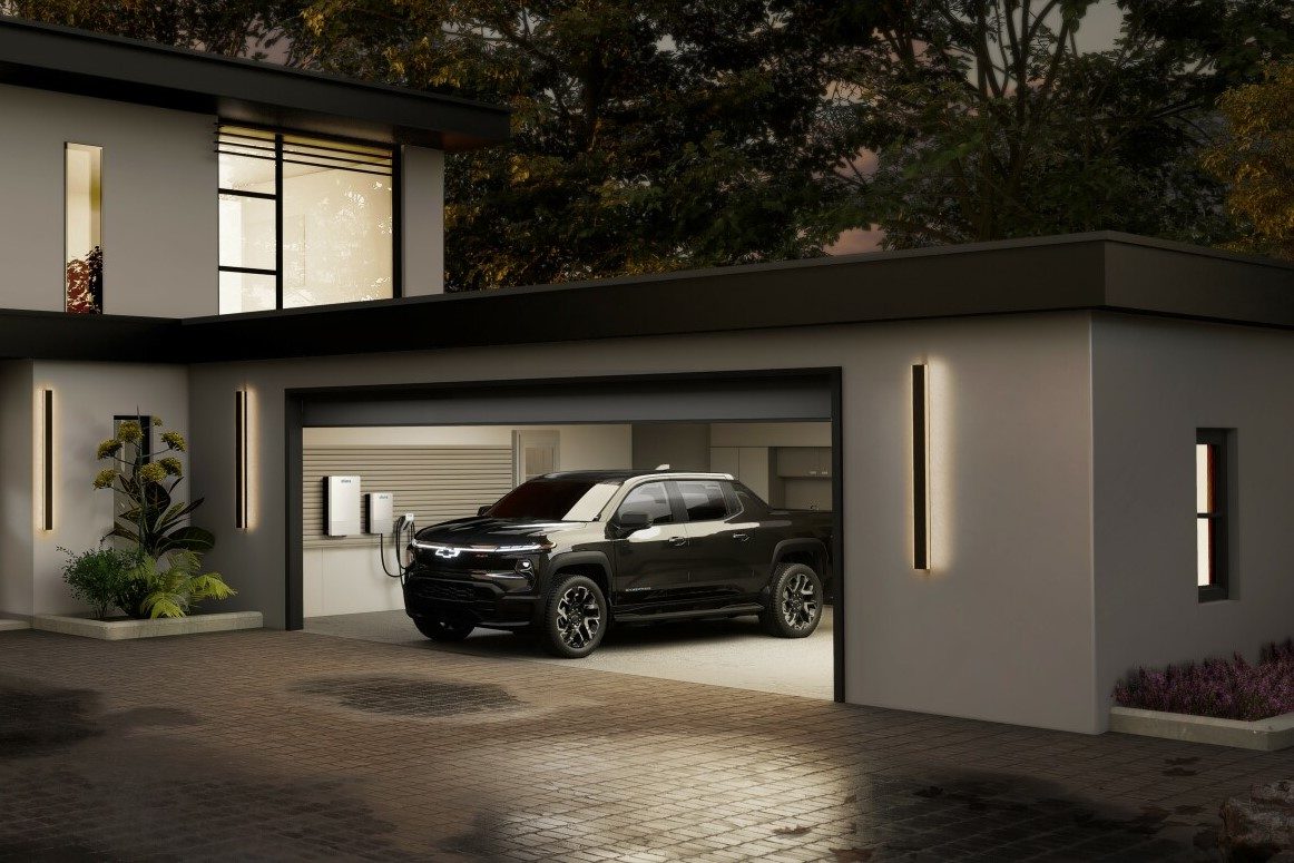 Chevy Silverado EV with V2H bidirectional charging capability connected to a home