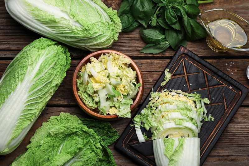 Heads of cabbage on a cutting board