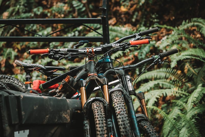Mountain bikes resting in the back of a truck