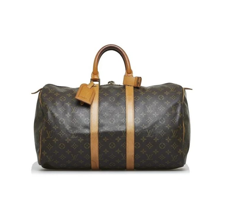 The Louis Vuitton Keepall with its handles in the air, as if ready to be picked up.