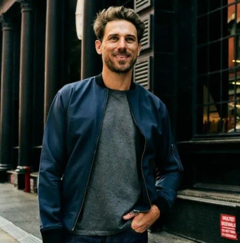 Man wearing Woodies bomber jacket