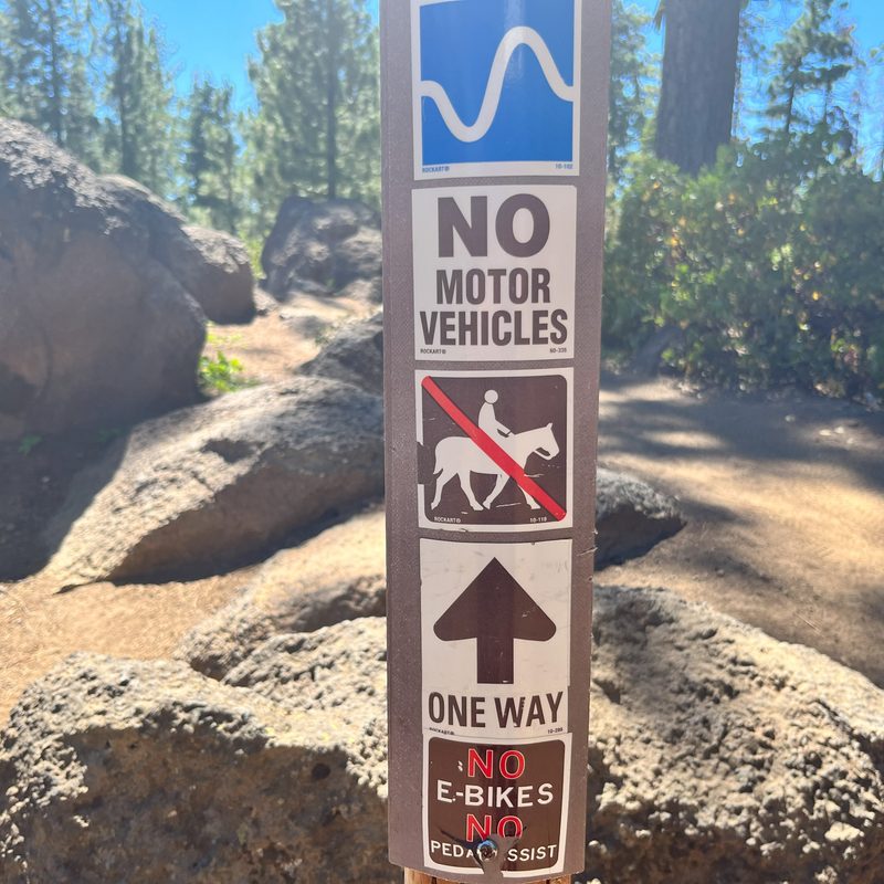 A trail marker giving lots of different information about the trail