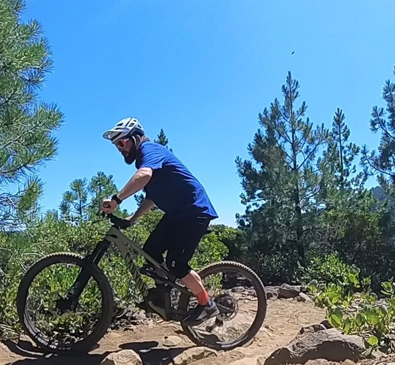 Mountain biking up a trail