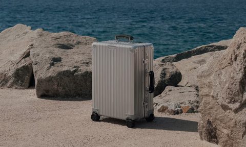 Rimowa suitcase by the beach