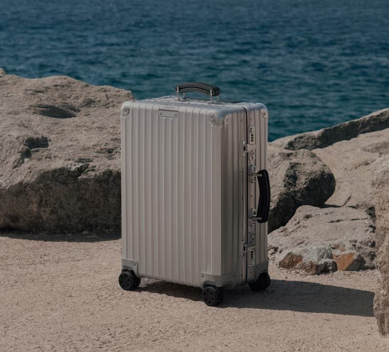 Rimowa suitcase by the beach