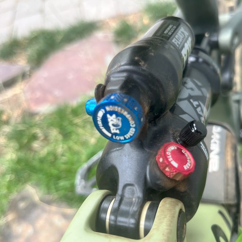 A Fox Float X mountain bike rear shock showing rebound and compression adjustments
