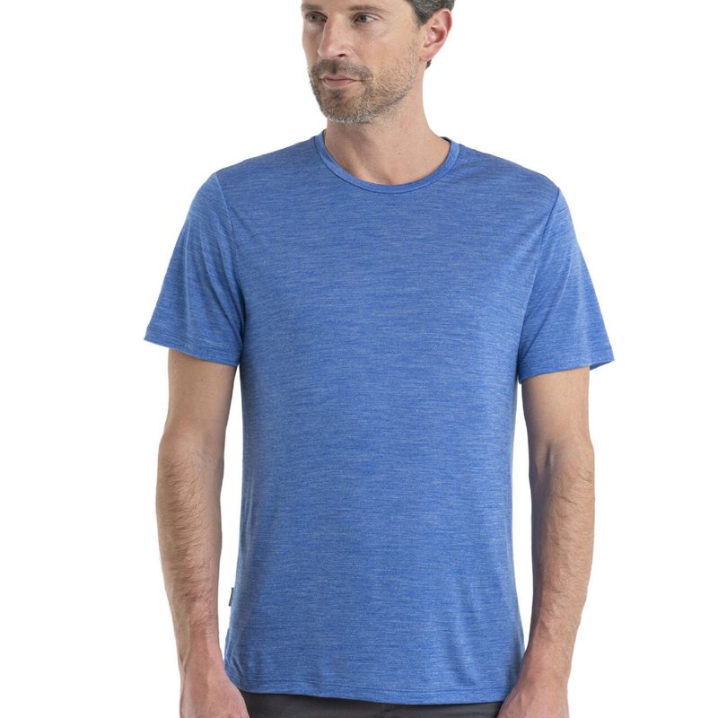 Man wearing a blue Icebreaker Sphere II T-shirt
