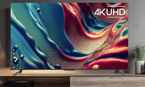 TCL 85 inch Q6 QLED 4K smart Google TV lifestyle image in living room.