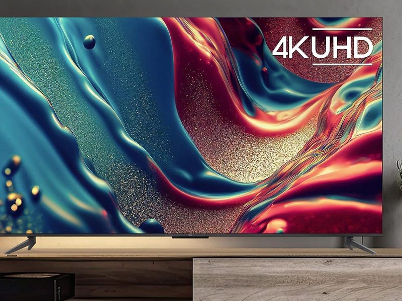 TCL 85 inch Q6 QLED 4K smart Google TV lifestyle image in living room.