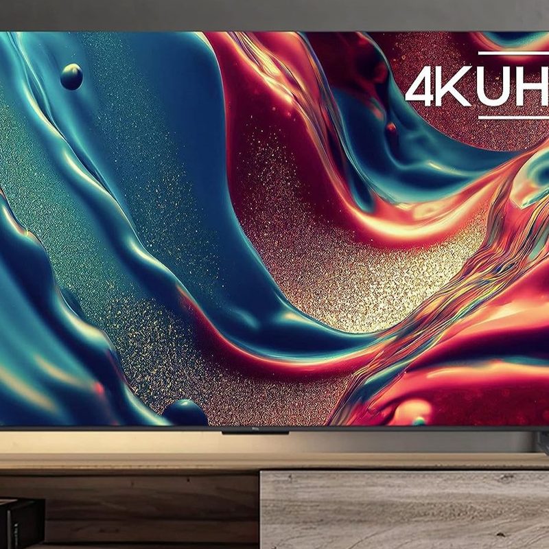 TCL 85 inch Q6 QLED 4K smart Google TV lifestyle image in living room.