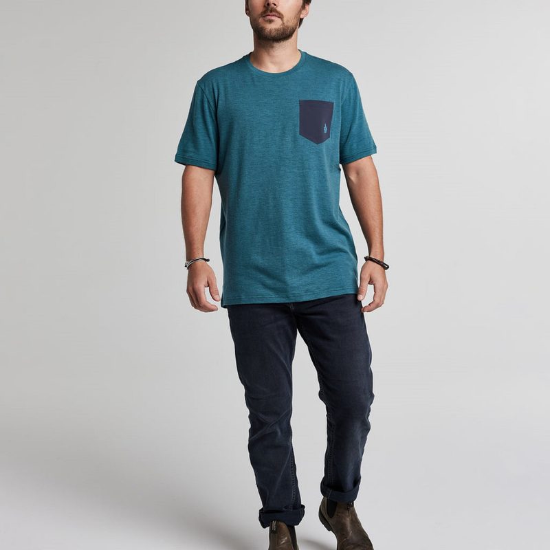 Man wearing a blue TREW t-shirt and jeans