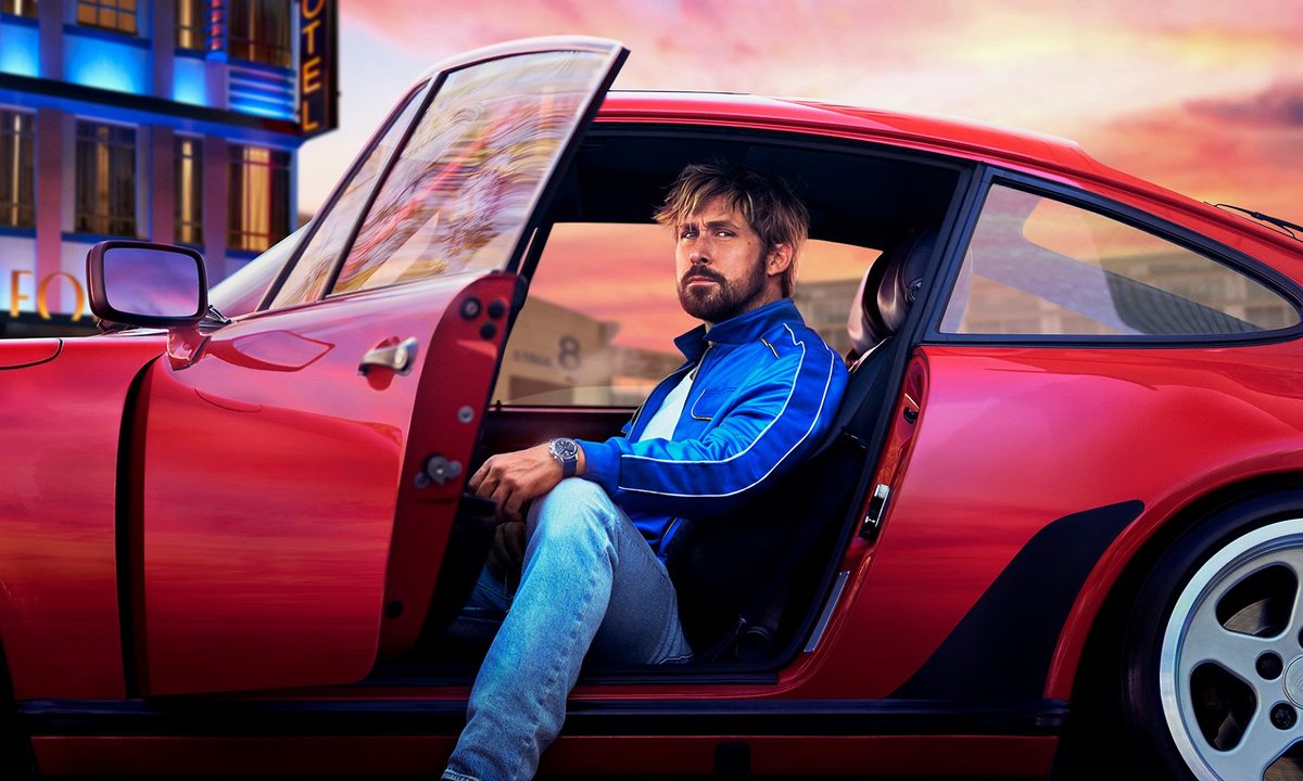Ryan Gosling in a red car wearing a Tag Heuer watch