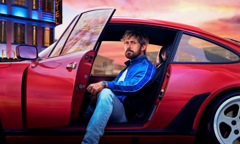 Ryan Gosling in a red car wearing a Tag Heuer watch