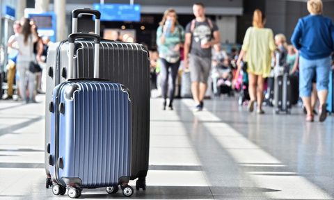 Two of the Travelhouse suitcases in an airport.