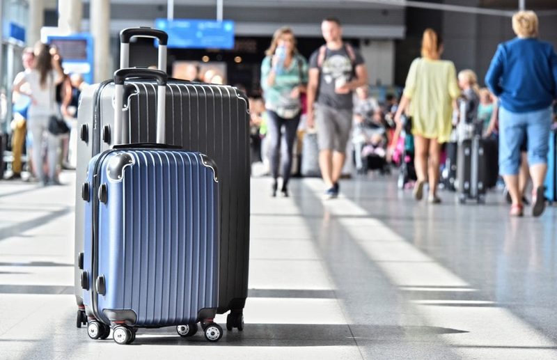Two of the Travelhouse suitcases in an airport.
