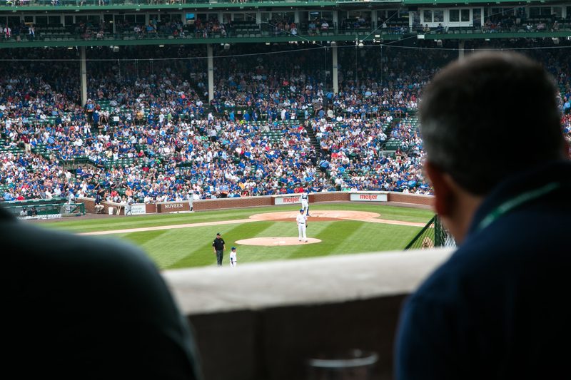 Announcers commenting on a baseball game in play.