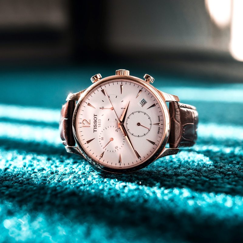 Tissot watch laying on floor