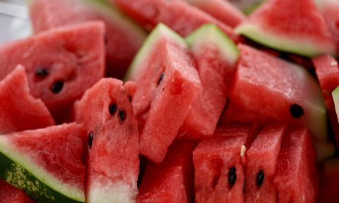 Sliced watermelon in a pile.