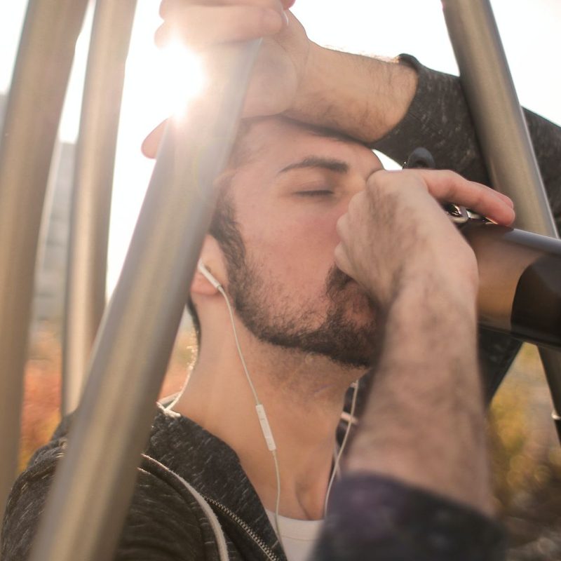 Man drinking water in the sunlight