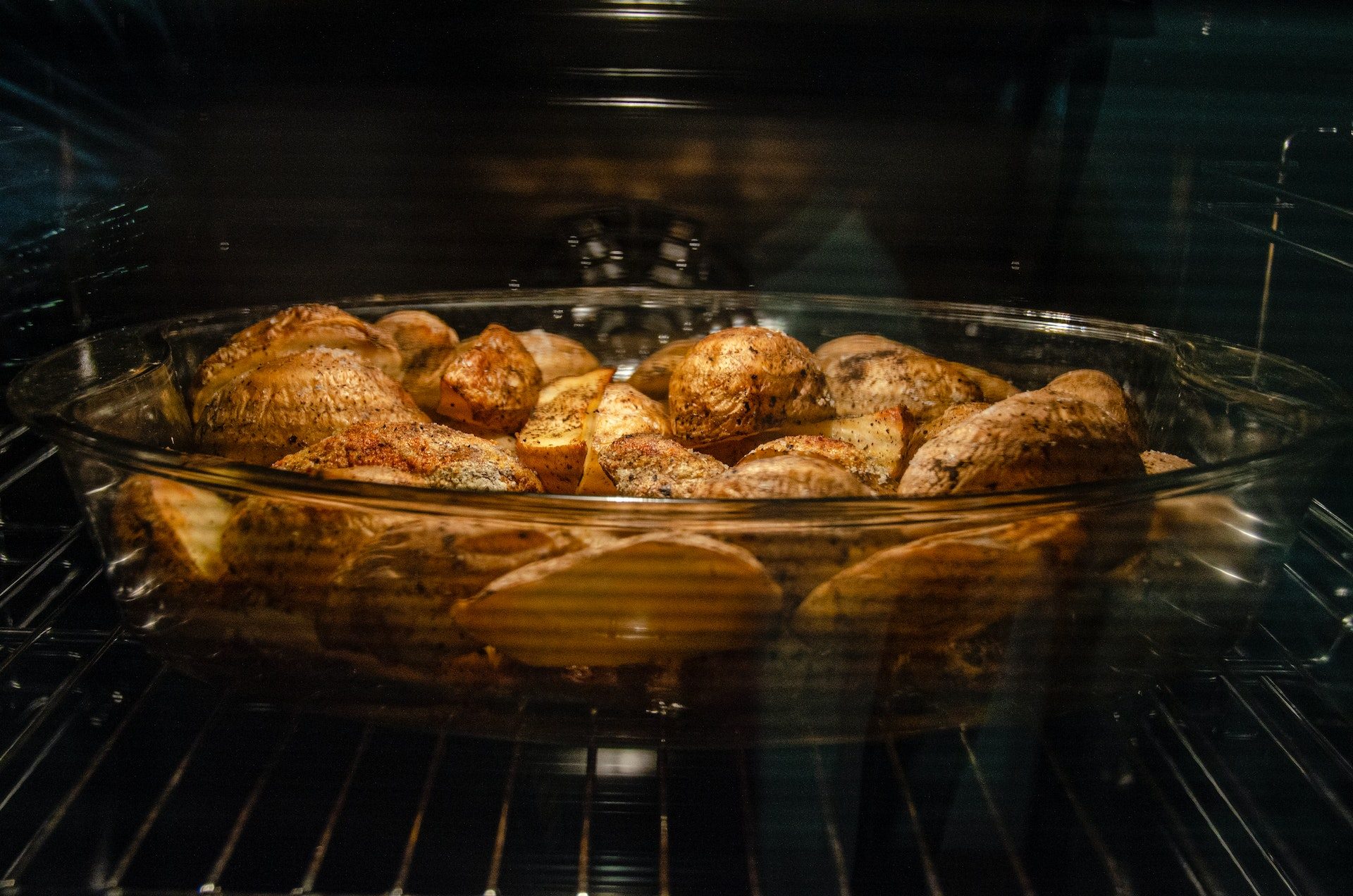 Potatoes baking inside oven