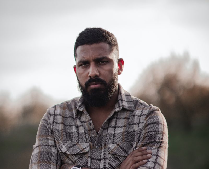 Man with a crew cut and flannel