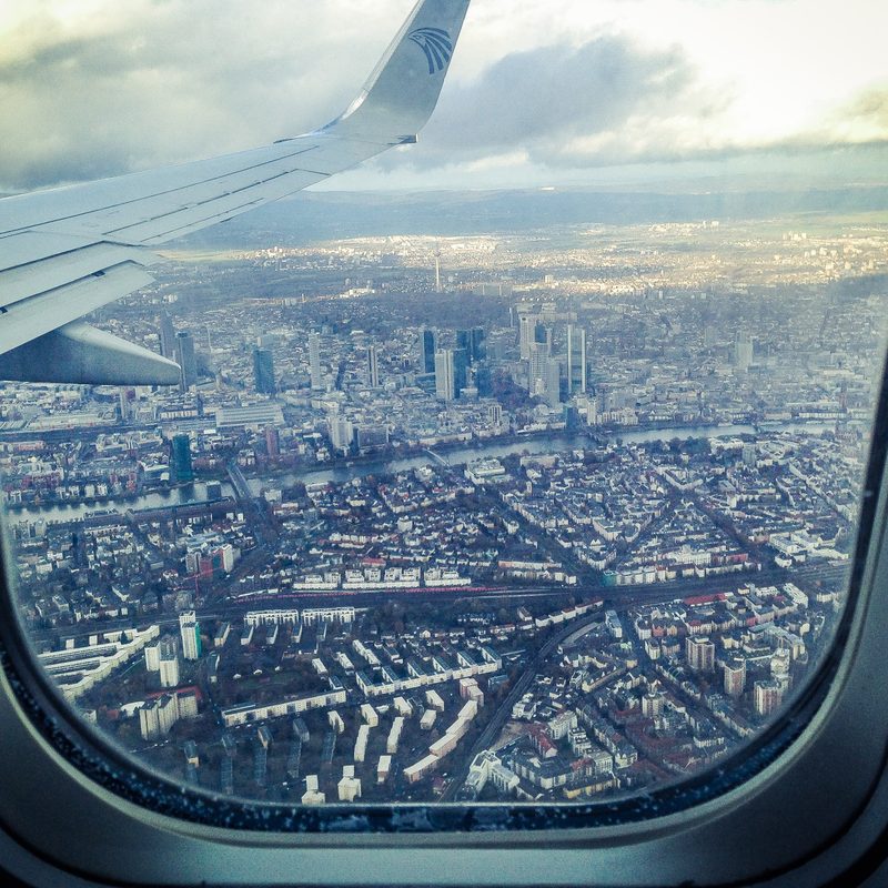 View of city city buildings from an airplane window