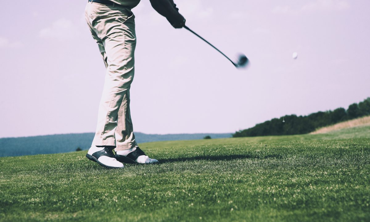 Man swinging a golf club