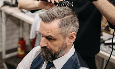 buzz cut mens hairstyles barber cutting a brush