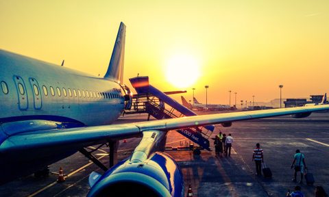 plane boarding at sunset