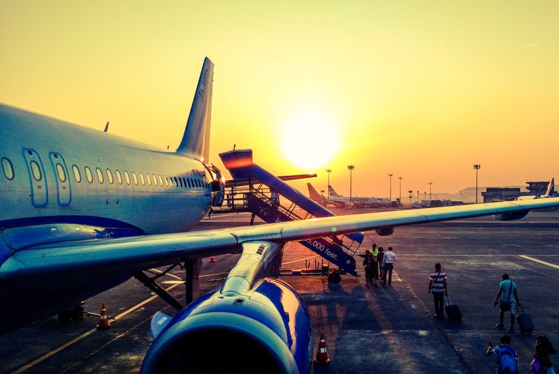 plane boarding at sunset