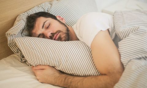 Man sleeping in t-shirt